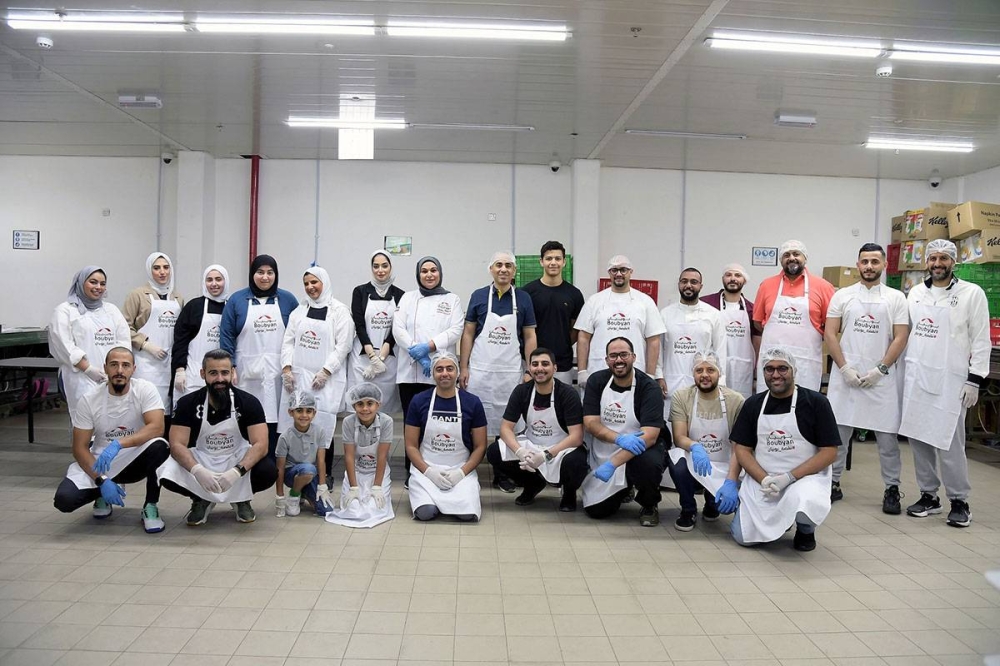 فريق «بوبيان» التطوعي أثناء إعداد «نقصة بوبيان»