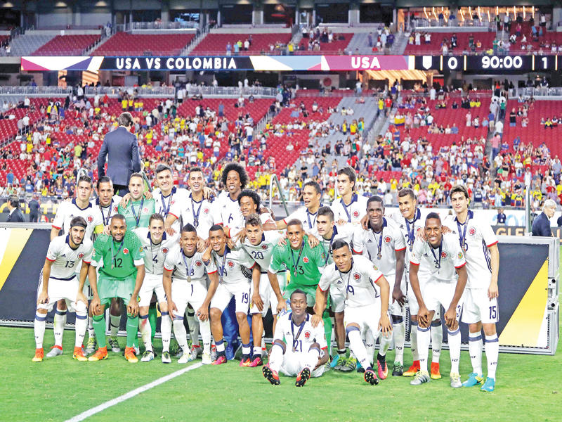 لاعبو كولومبيا بعد تقلد ميداليات المركز الثالث