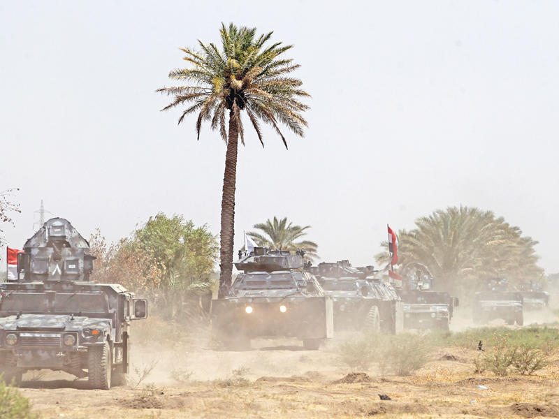 جانب من العمليات العسكرية قرب قضاء سنجار        (أ ف ب)