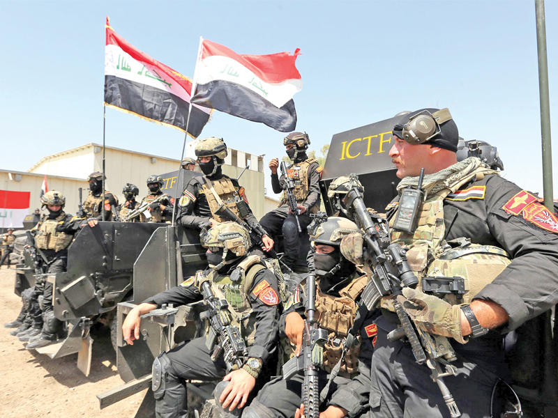 عناصر من القوات الخاصة في الجيش العراقي خلال تدريب في مطار بغداد أمس   (أ ف ب)