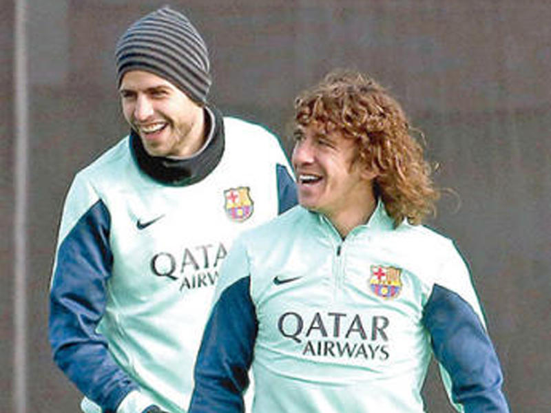 بويول وبيكيه خلال تدريبات برشلونة