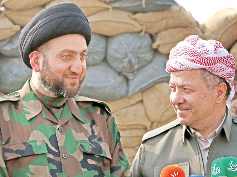 بارزاني مستقبلاً الحكيم على محور الخازر أمس (أ ف ب)