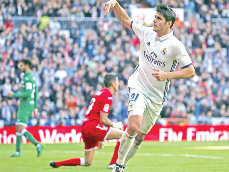 موراتا نجم الريال يحتفل بعد إحرازه هدفا في مرمى ليغانيس