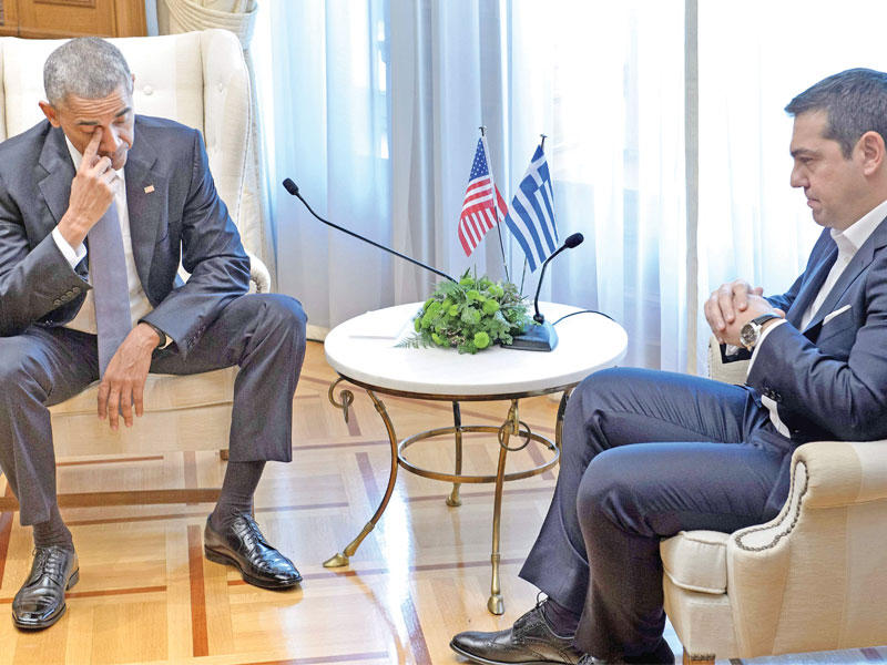 وجوم خلال لقاء رئيس الحكومة اليونانية اليكسيس تسيبراس وأوباما في اثينا أمس                (أ ف ب)