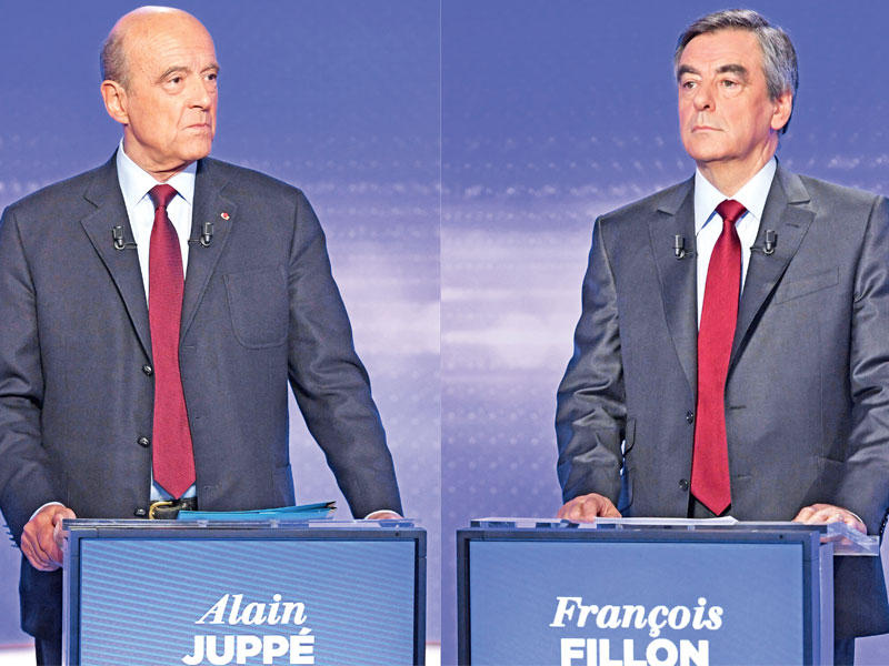 فيون (يمين) وجوبيه في اخر مناظرة بينهما في 17 الجاري (أ ف ب)