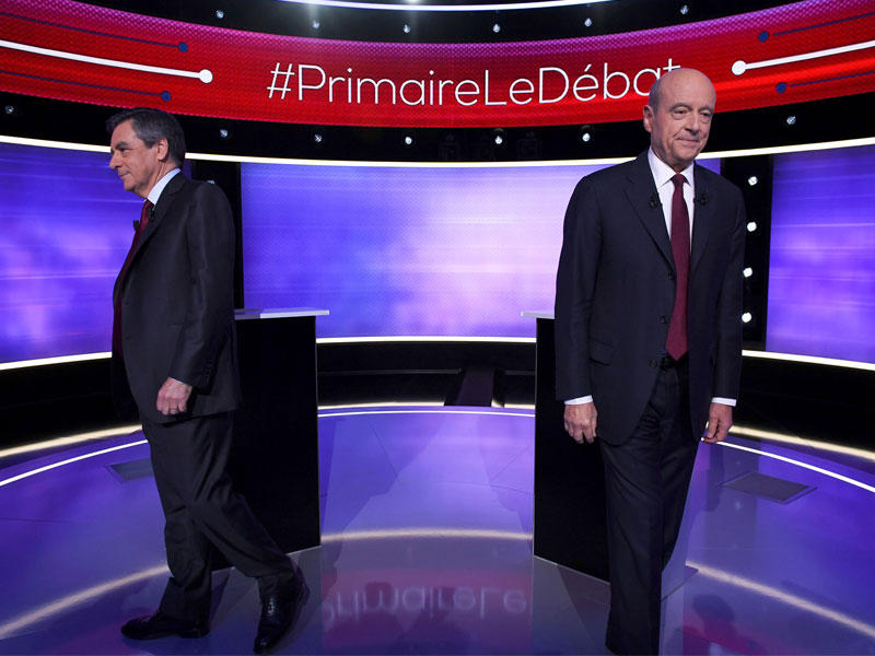 فيون وجوبيه خلال المناظرة مساء أمس الأولt(أ ف ب)