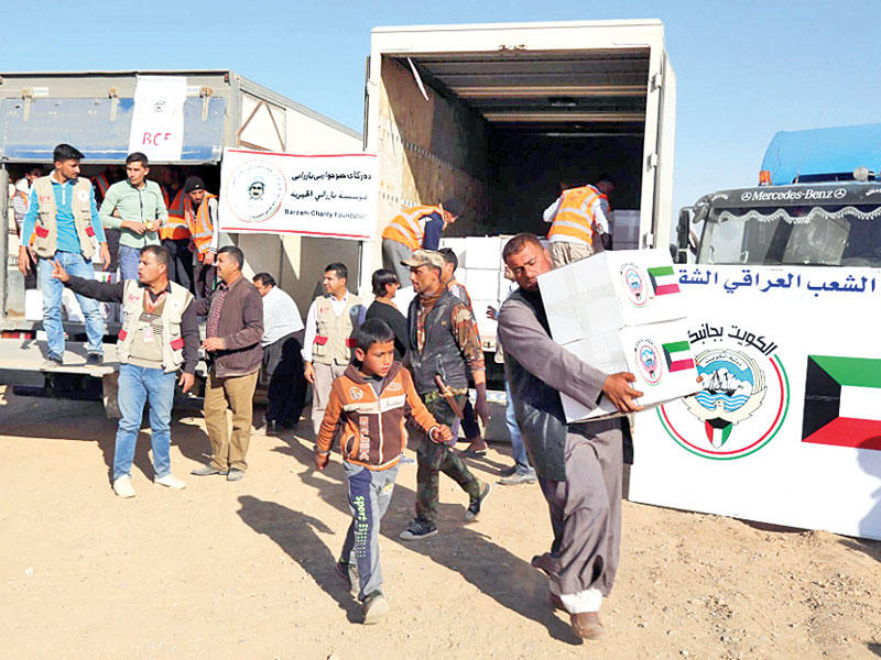 جانب من توزيع المساعدات في مناطق نينوىn