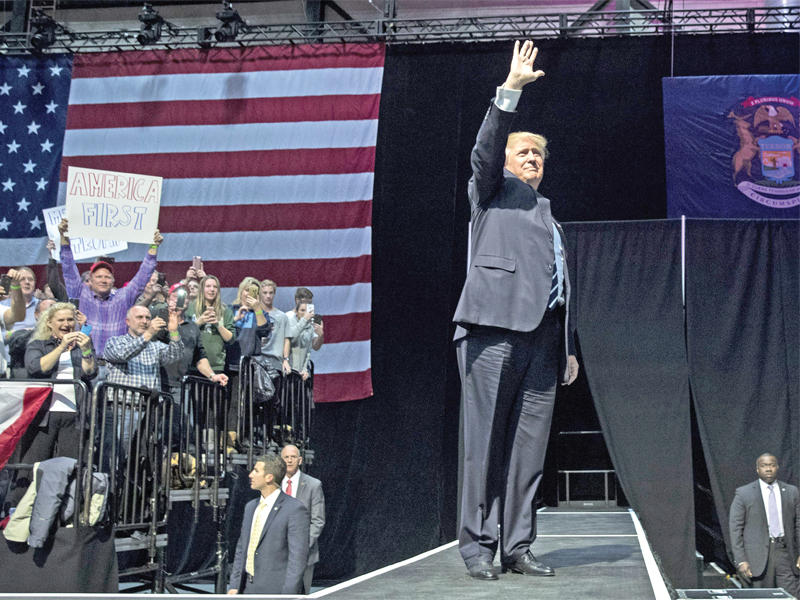 ترامب في ميشيغان أمس الأول t(أ ف ب) 