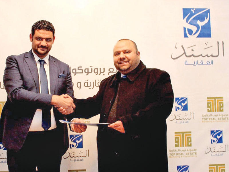 محمد فرغلي ومجدي سعد بعد توقيع الاتفاقية