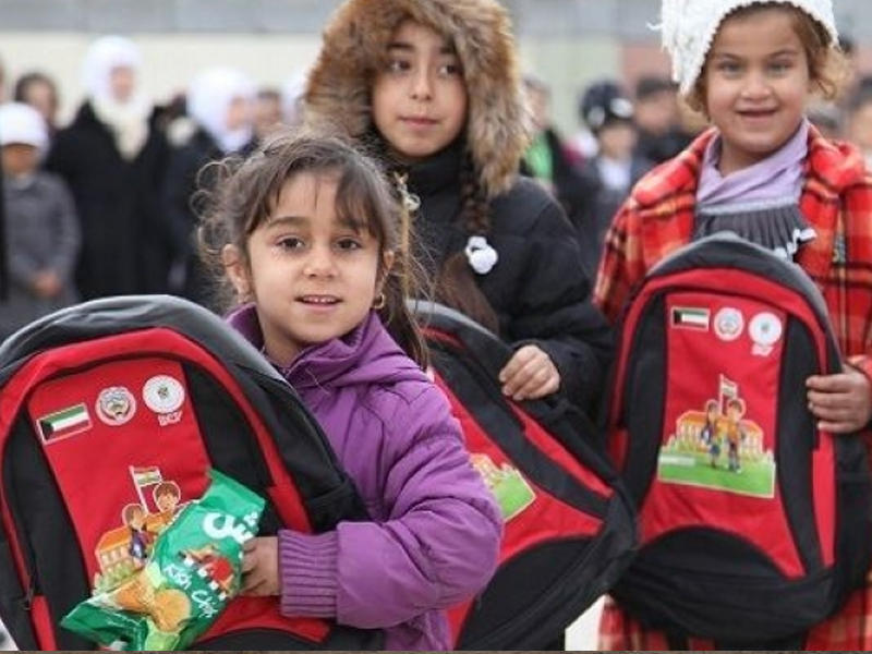 صورة لأطفال يحملون حقيبة مدرسية  في أربيلn