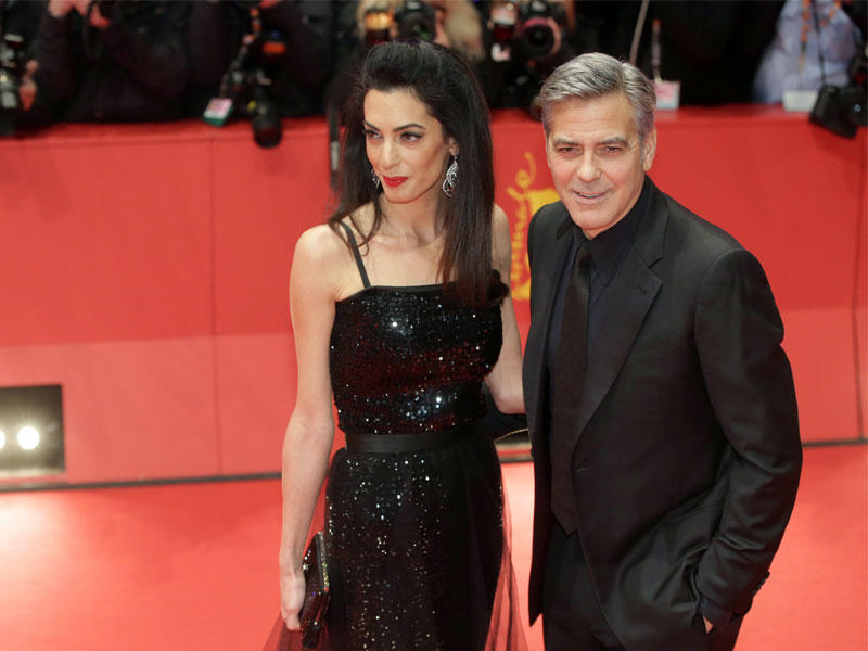 الممثل الامريكى جورج كلوني وزوجته أمل كلوني