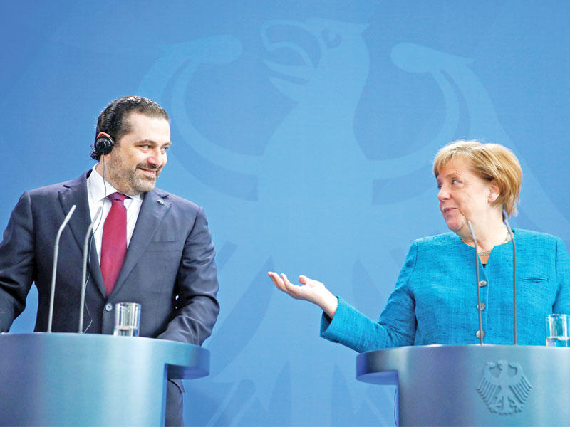 الحريري وميركل في برلين أمس (رويترز)