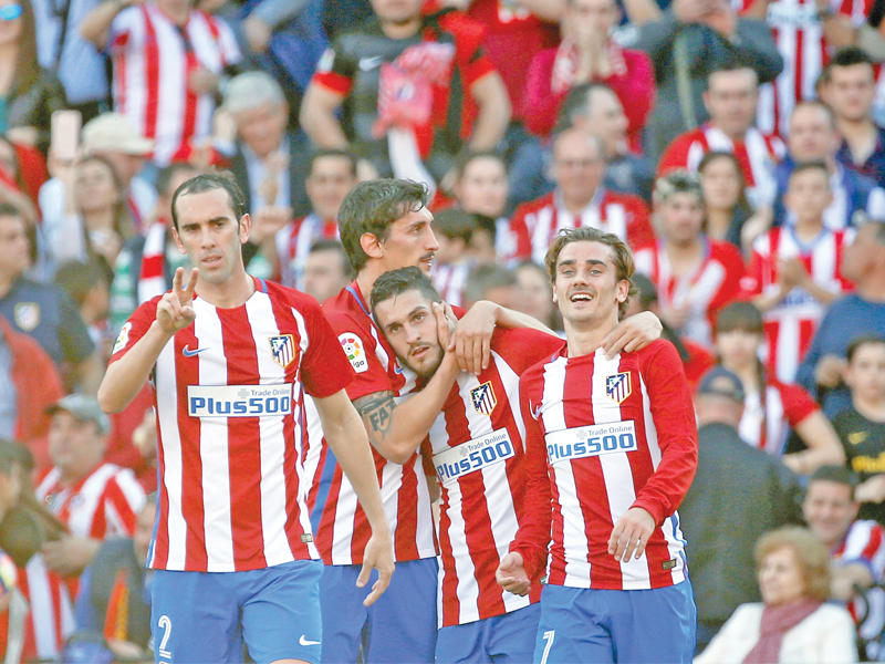 لاعبو أتلتيكو مدريد خلال مباراة سابقة