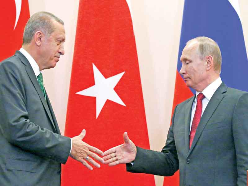 بوتين وإردوغان في سوتشي أمس  (رويترز)