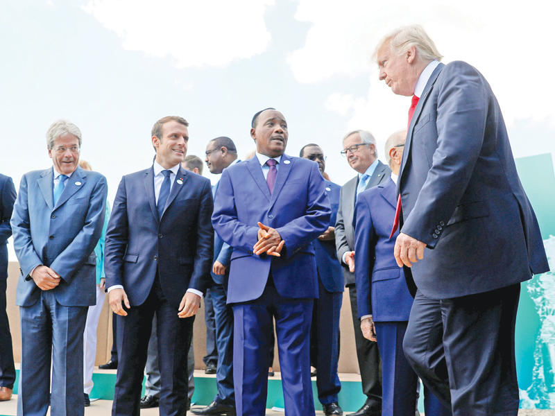 ترامب الى جانب قادة الدول السبع ورئيسي النيجر وتونس في صقلية اليوم t (رويترز)