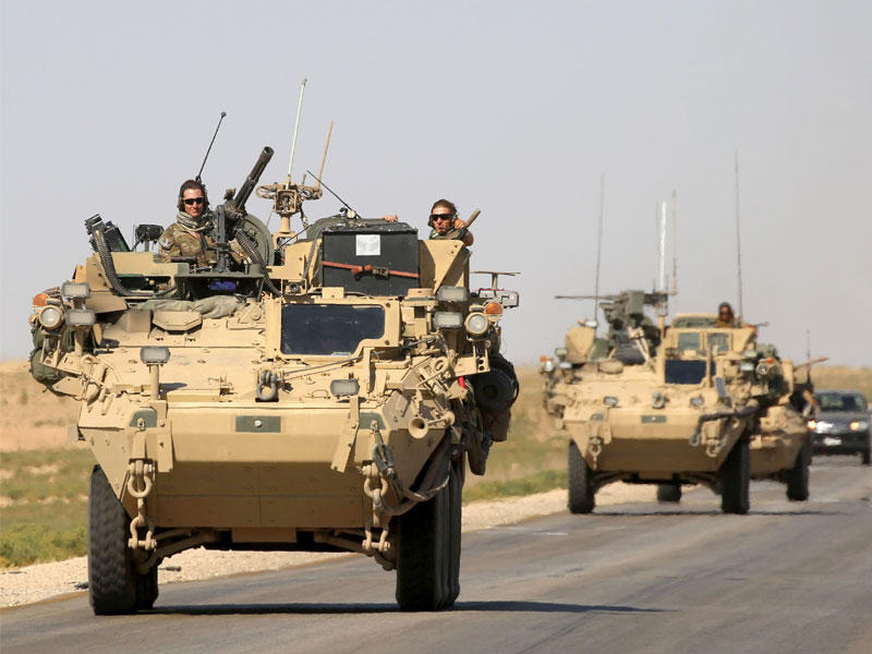 دورية أميركية قرب بلدة عين عيسى شمال سورية أمس  (أ ف ب)