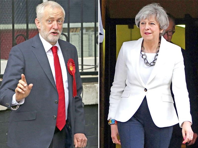 كوربن وماي بعد تصويتهما  اليوم ( أ ف ب)