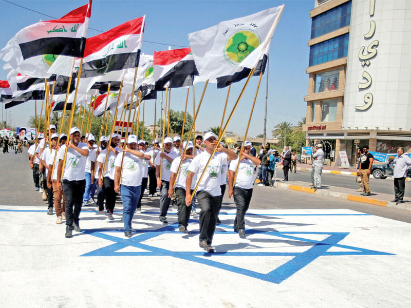 جانب من مسيرة عراقية لإحياء ذكرى يوم القدس في شارع فلسطين وسط بغداد أمس(رويترز)