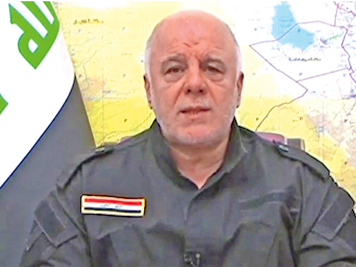 العبادي لحظة إعلانه بدء العمليات العسكرية في قضاء تلعفر أمس (أ ف ب)