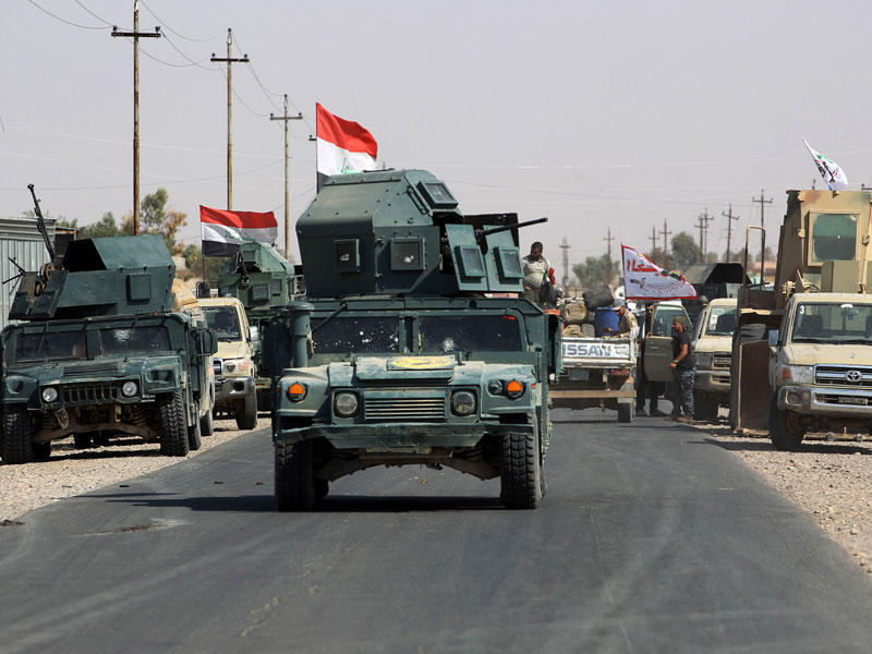 القوات العراقية المشتركة داخل بلدة شرقات أمس (أ ف ب)