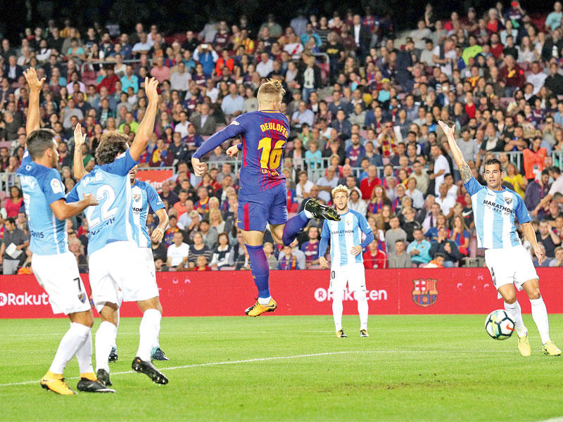 هدف ديلوفيو  نجم البرشا الذي اثار اعتراض لاعبي ملقا