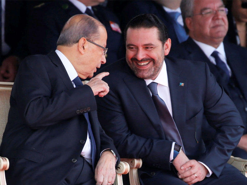 عون والحريري خلال الاستعراض العسكري بمناسبة عيد الاستقلال في بيروت امس (رويترز)