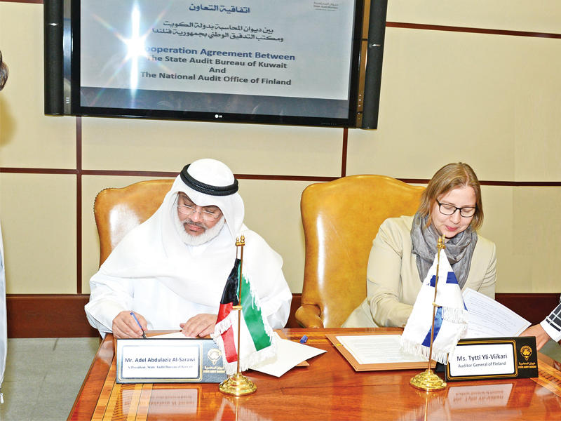 الصرعاوي خلال توقيع اتفاقية التعاون مع مكتب التدقيق الفنلندي