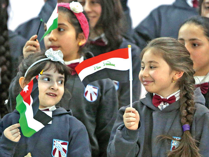 أطفال عراقيون في مدرسة للاجئين المسيحيين في عمانtttt             (أ ف ب )