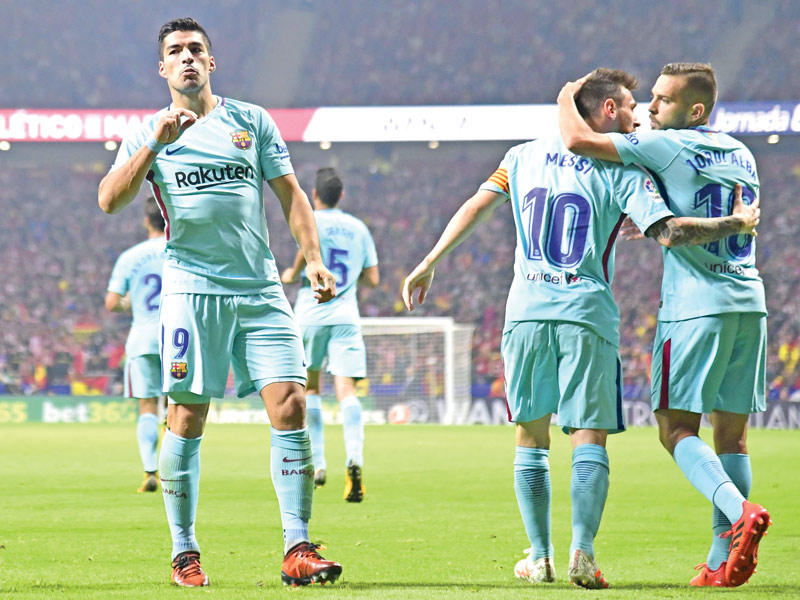 لاعبو برشلونة خلال مباراة سابقة في الدوري الإسباني