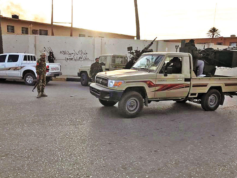 صورة وزعتها «قوة الردع» تظهر عناصرها بمحيط مطار معيتيقة أمس