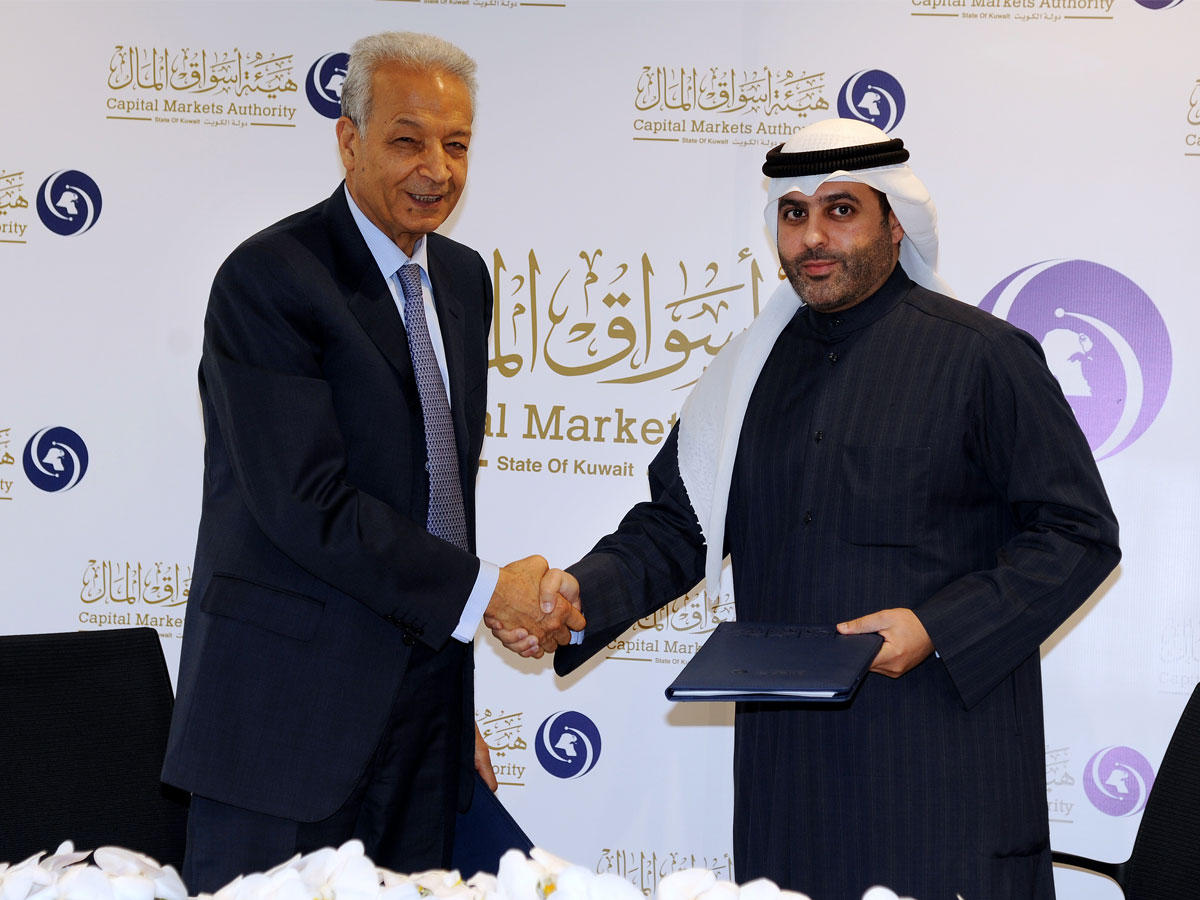 العصيمي وسرطاوي بعد توقيع الاتفاقية