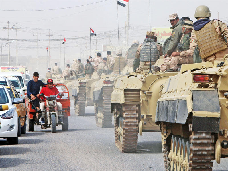 عدد من التعزيزات الأمنية التي وصلت إلى البصرة أمسt(رويترز)