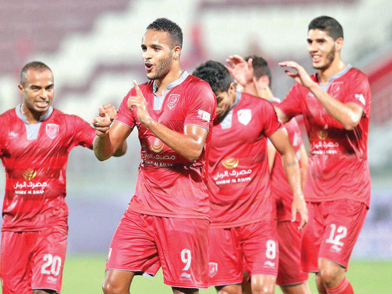 المغربي يوسف العربي نجم فريق الدحيل يحتفل بتسجيله هدفاً في لقاء سابقn