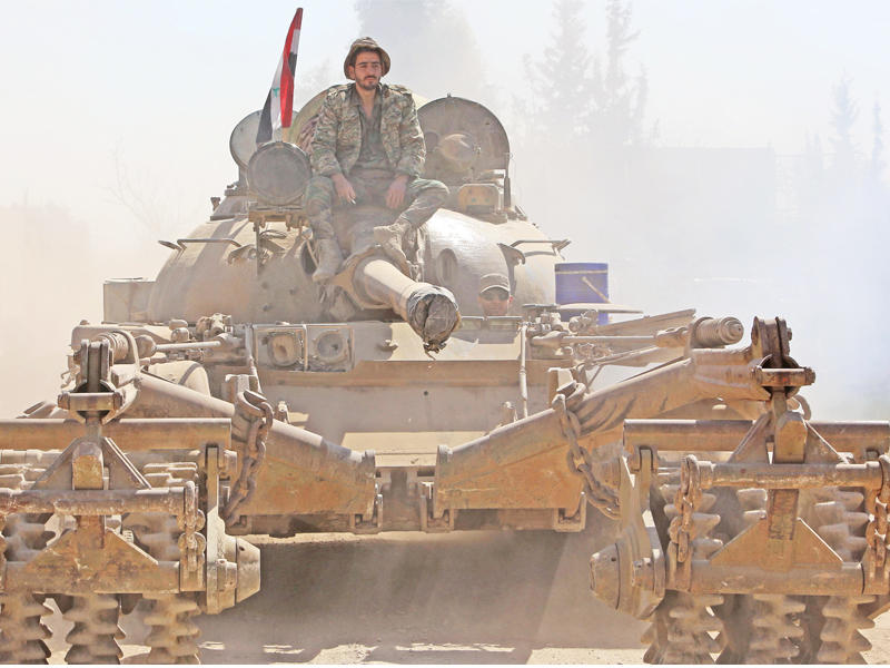 قوات النظام في بيت سوا أمس (أ ف ب)