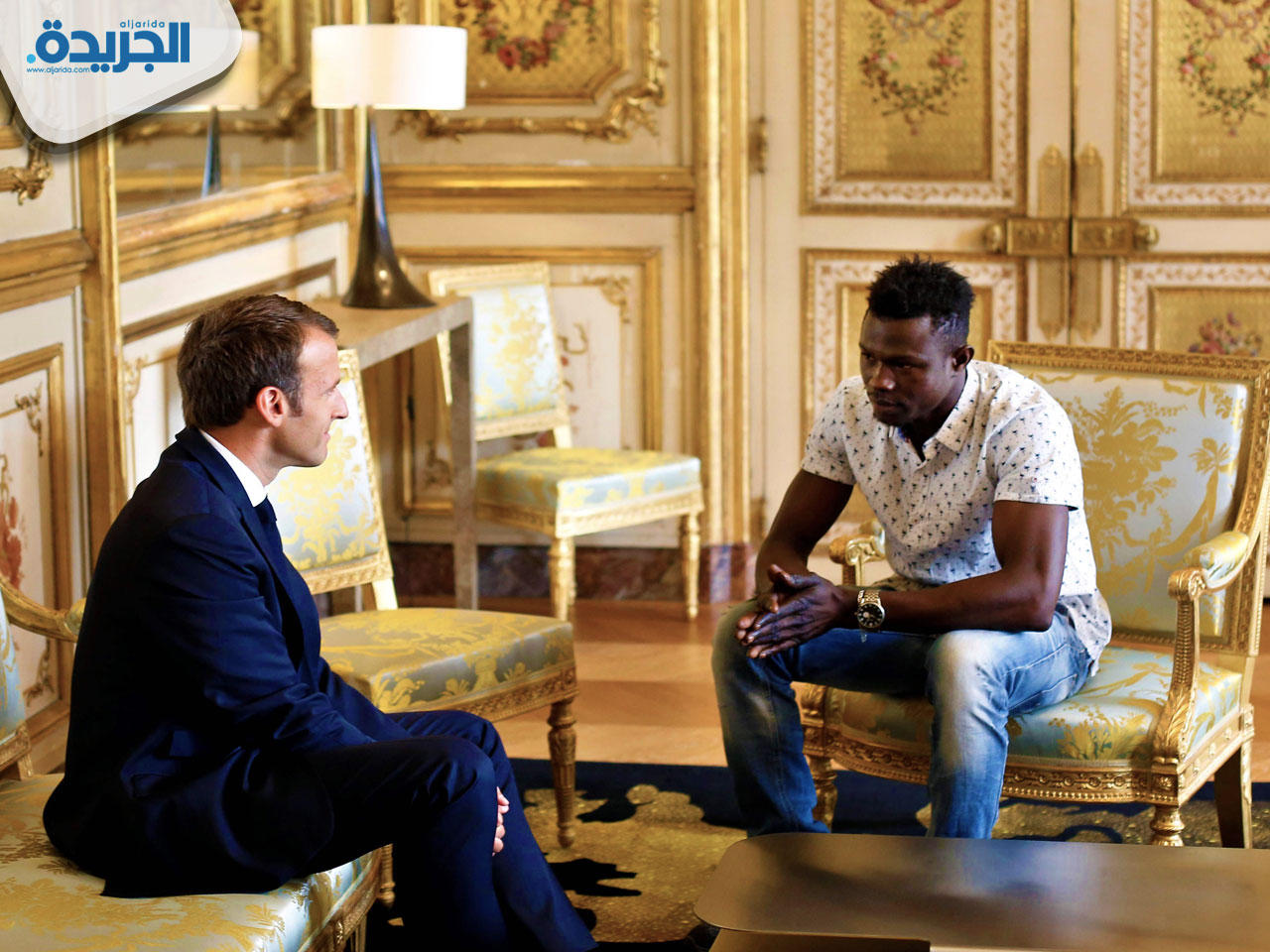 الرئيس الفرنسي إيمانويل ماكرون المهاجر المالي مامودو غاساما