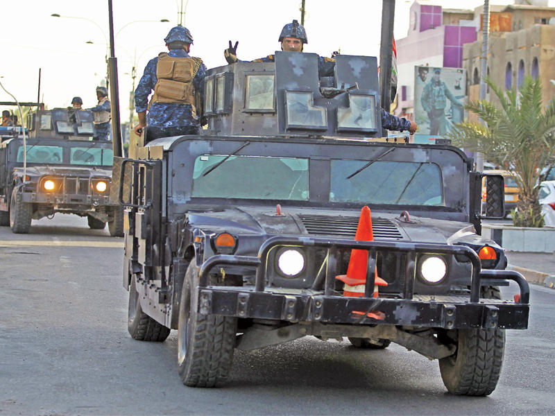 قوات أمنية منتشرة في شوارع بغداد أمس الأول  (أ ف ب)