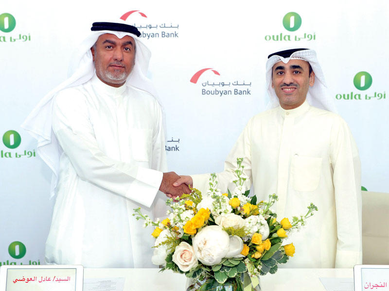 التويجري والعوضي عقب توقيع الاتفاقية