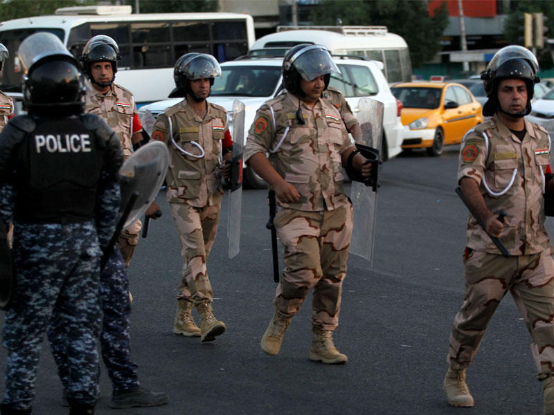 أفراد من قوات الأمن العراقية في ميدان التحرير ببغداد