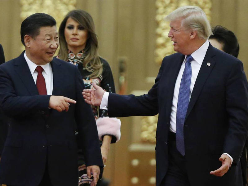 ترامب مع جين بينغ خلال قمتهما الأخيرة في الصينn
