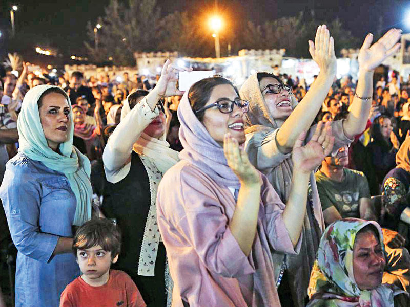 إيرانيون خلال تجمع احتفالي في برج ميلاد أمس الأول (إرنا)