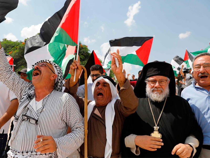 الأحمر قرب القدس في الضفة الغربية المحتلة أمس (أ ف ب)