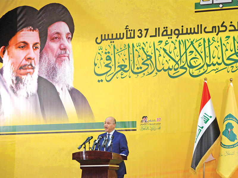 صالح يلقي كلمة خلال احتفالية المجلس الأعلى في بغداد أمس  (أي بي ايه)