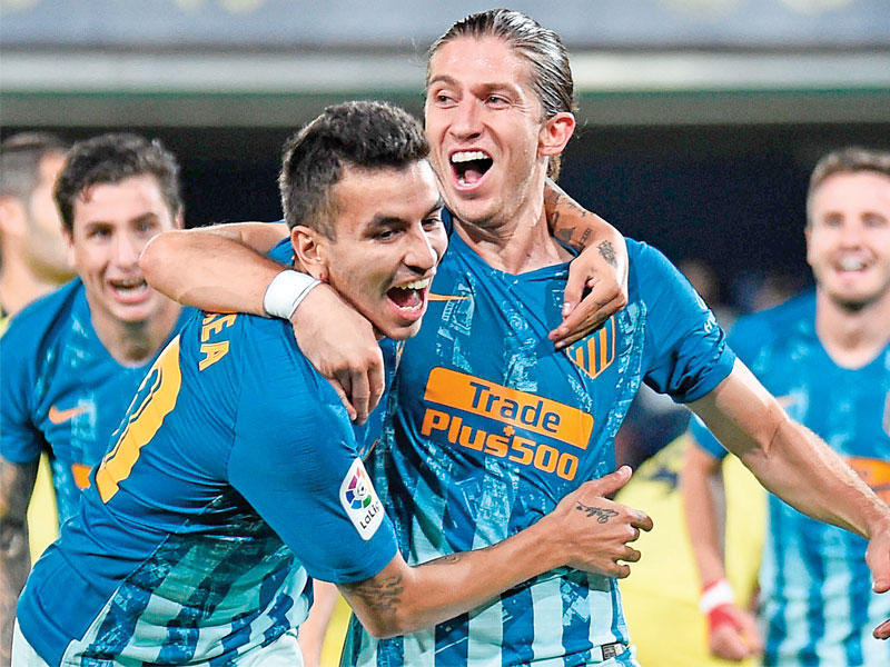 لاعبو أتلتيكو مدريد خلال مباراة سابقة