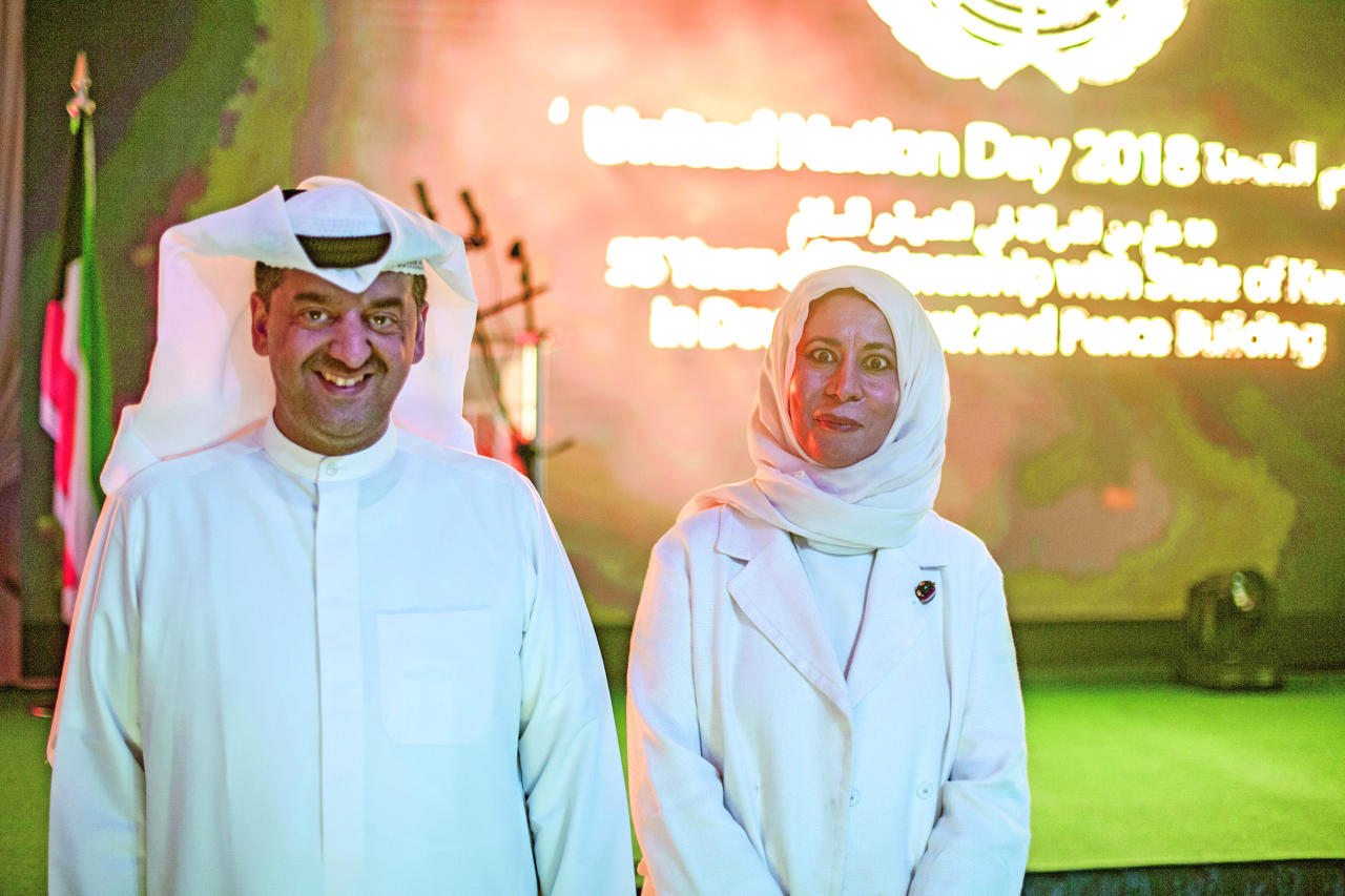  إيمان الروضان ووليد الخشتي خلال الحفل