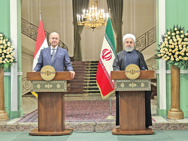 روحاني وصالح خلال مؤتمر مشترك في طهران أمس   (أ ف ب) 