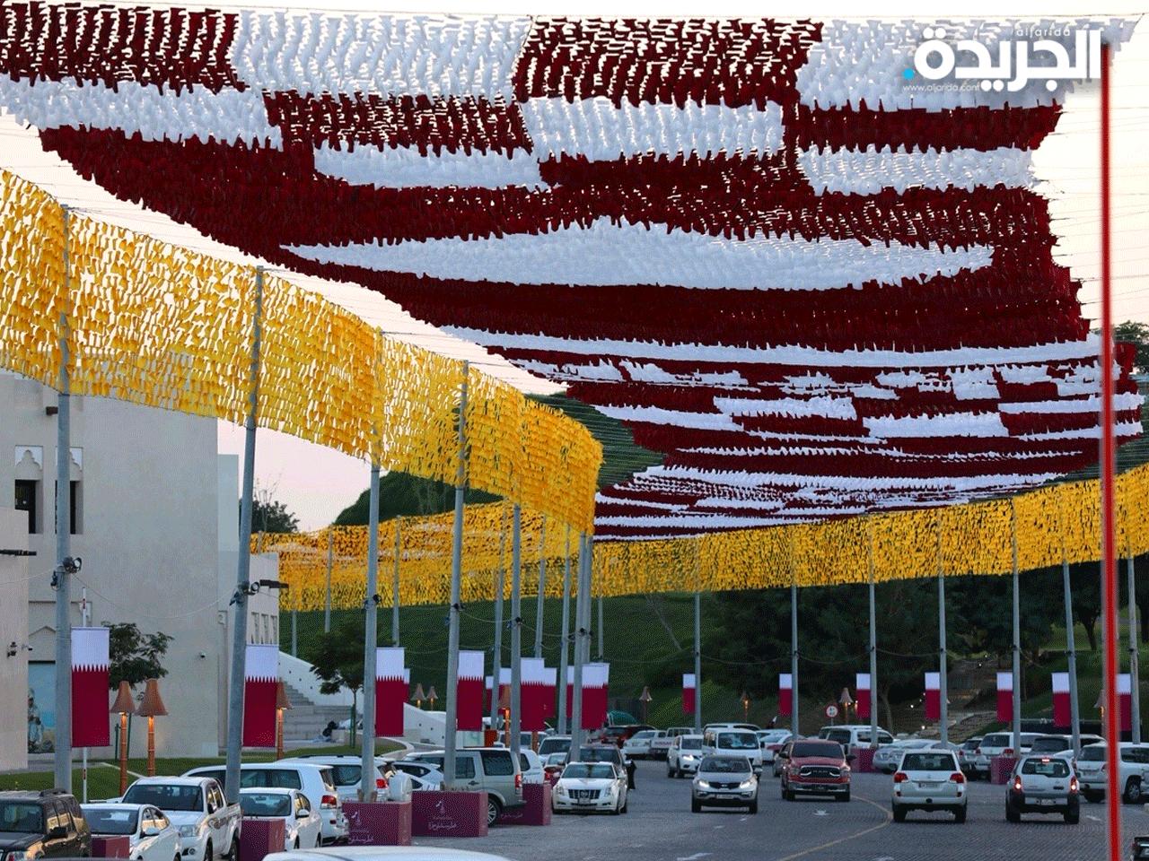  المدن القطرية التي ازدانت بأعلام البلاد واللونين الابيض والعنابي 