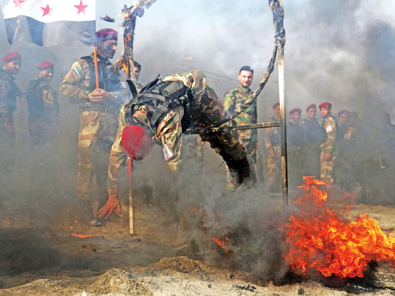 تدريبات لفصيل موال لتركيا في ريف حلب أمس الأول (أ ف ب)