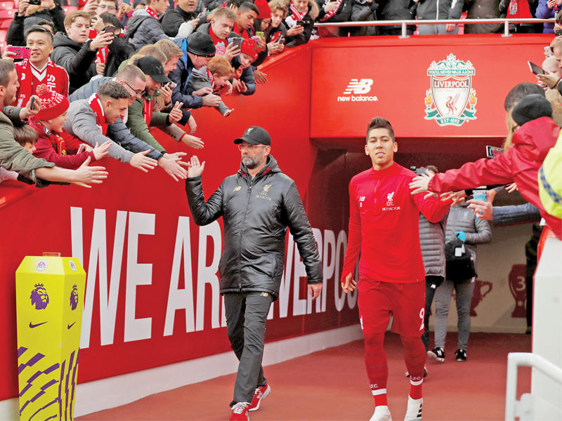 فيرمينيو نجم ليفربول والمدرب يورغن كلوب