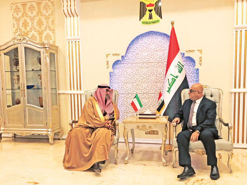 الوزير الروضان مع نظيره العراقي محمد العاني