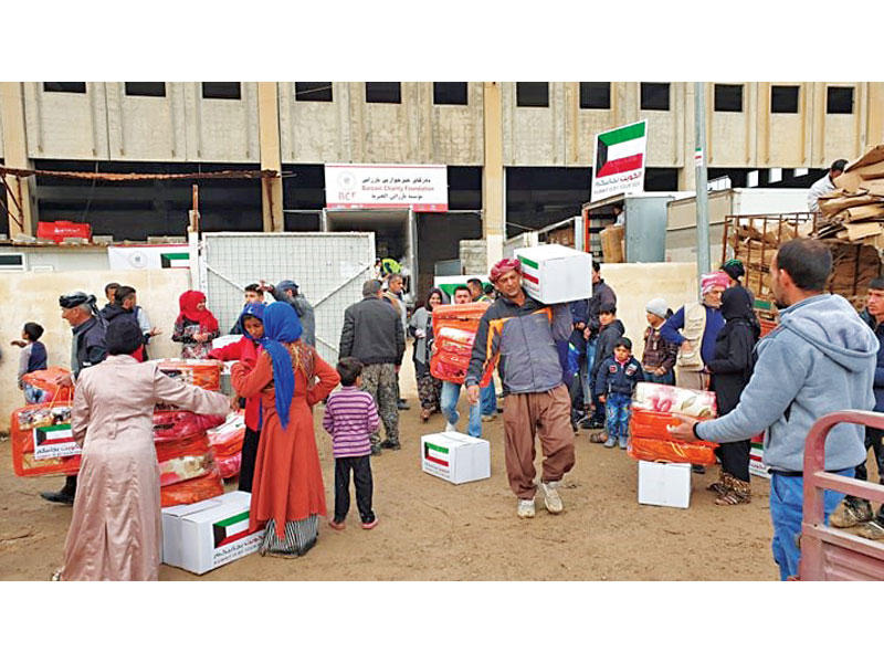 توزيع مساعدات لإغاثة النازحين العراقيين في اقليم كردستان